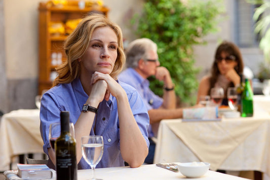 Actress Julia Roberts sitting at a table in Rome from the movie 'Eat, Pray, Love'